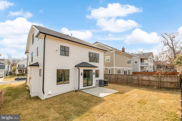 back of property with a patio area, cooling unit, fence, and a lawn