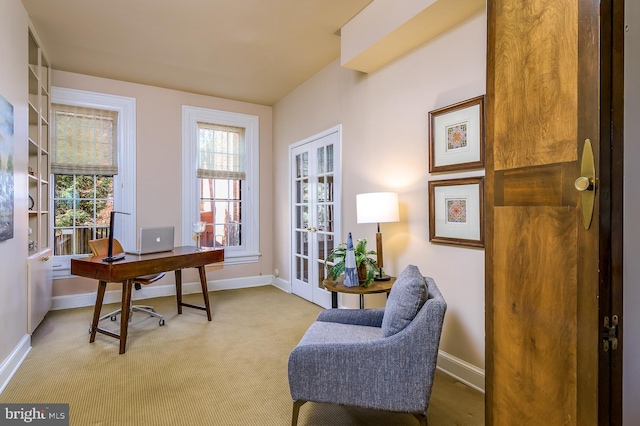 carpeted office featuring french doors