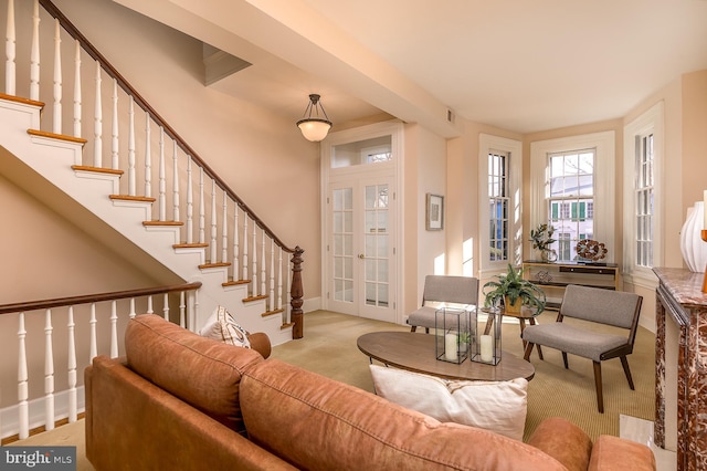 carpeted living room featuring french doors