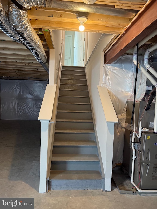 stairway with concrete flooring