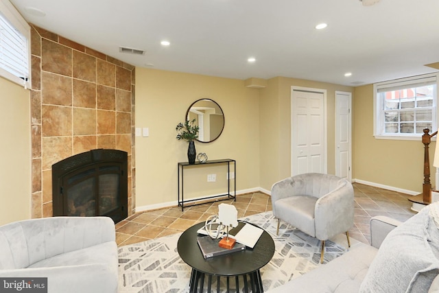 tiled living room with a fireplace