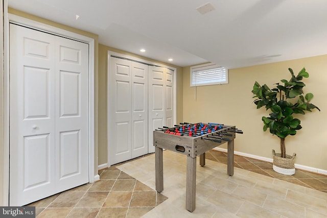 game room featuring light tile patterned floors