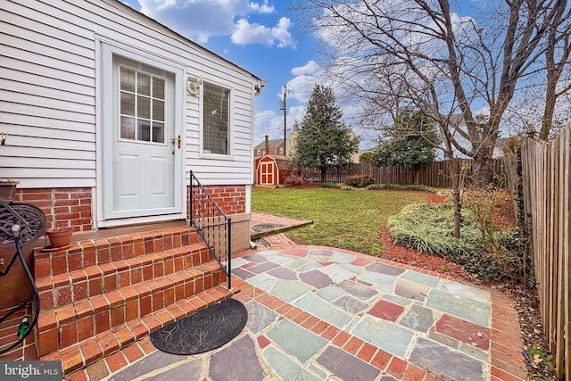 view of patio / terrace with a storage unit