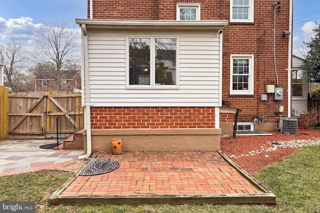 exterior space featuring central AC unit and a patio