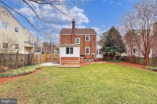 back of property featuring a patio, a yard, and central air condition unit