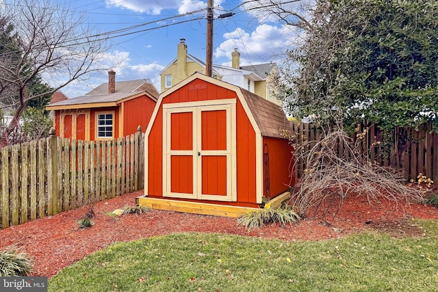 view of outdoor structure featuring a lawn