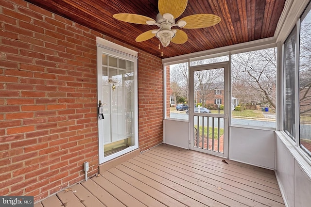 unfurnished sunroom featuring wood ceiling