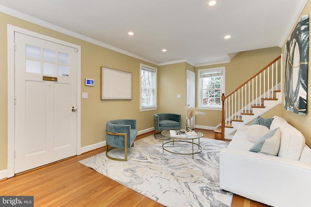 entryway featuring wood-type flooring and crown molding