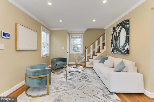 living room with crown molding and hardwood / wood-style floors