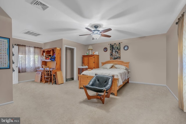 bedroom with ceiling fan and light colored carpet