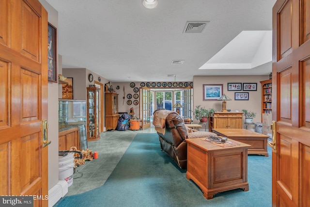 living room with a textured ceiling