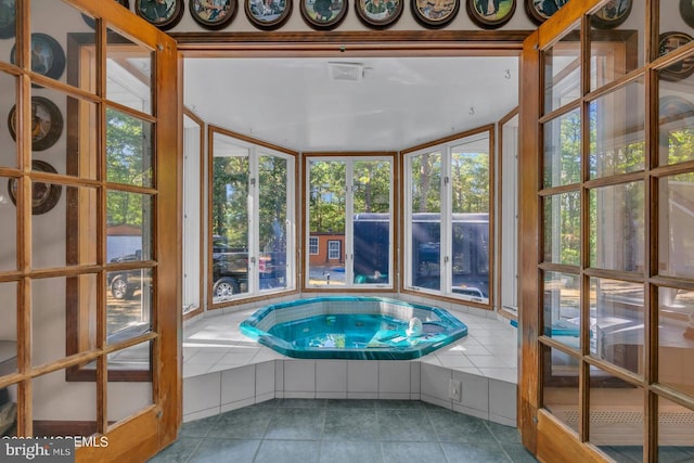 interior space featuring an indoor in ground hot tub