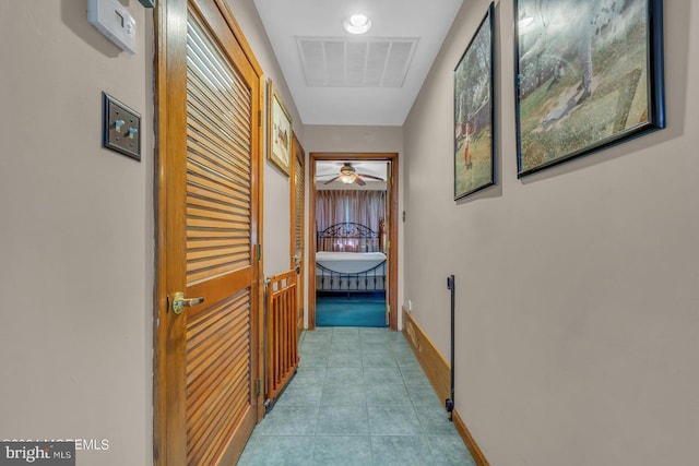 hallway featuring light tile patterned flooring