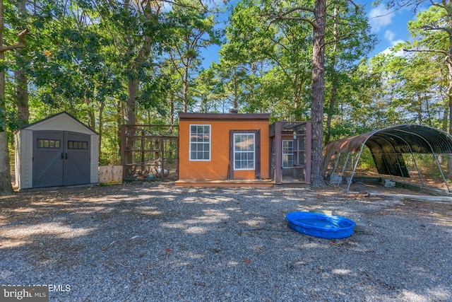 view of outbuilding with a carport