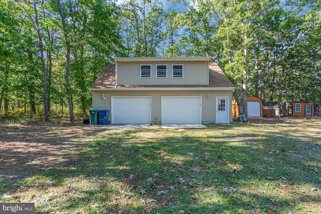 garage featuring a lawn