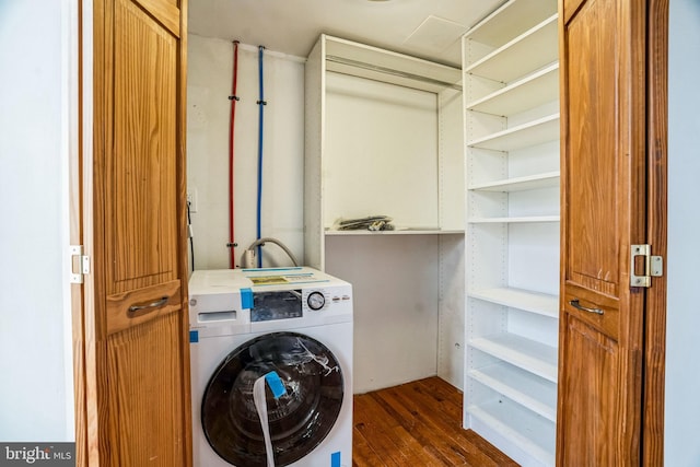 washroom featuring washer / dryer and dark wood-style floors