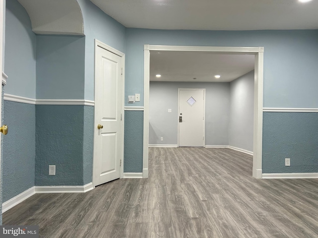 unfurnished room featuring hardwood / wood-style flooring