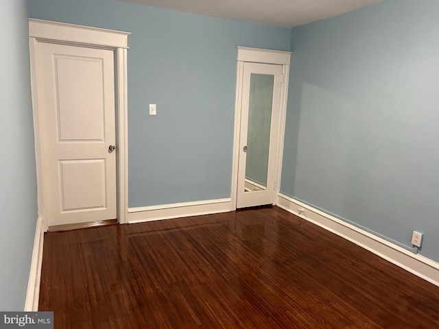 spare room with hardwood / wood-style floors