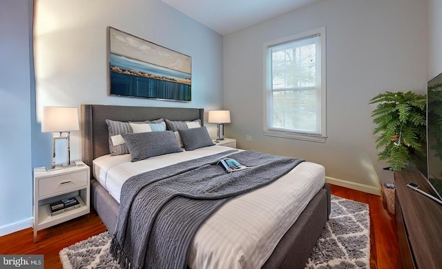 bedroom featuring dark hardwood / wood-style floors