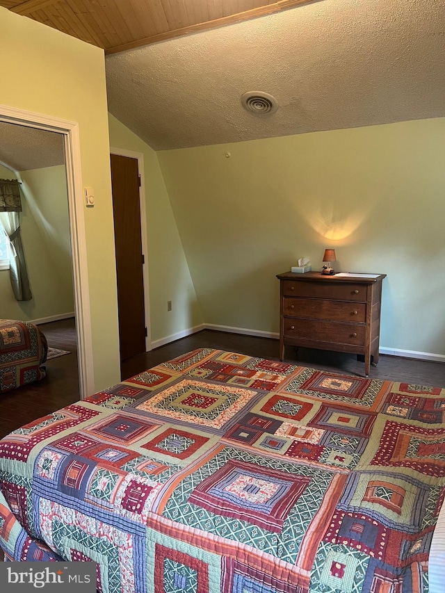30 Foggy Bottom Ln, Berkeley Springs, WV 25411 - bedroom with vaulted ceiling and a textured ceiling