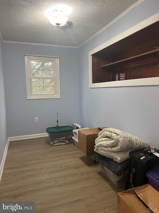 30 Foggy Bottom Ln, Berkeley Springs, WV 25411 - interior space featuring hardwood / wood-style flooring, ornamental molding, and a textured ceiling
