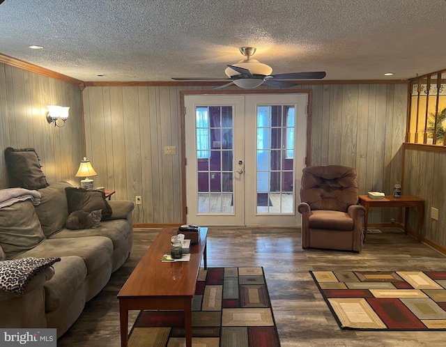 30 Foggy Bottom Ln, Berkeley Springs, WV 25411 - living room featuring french doors, dark hardwood / wood-style flooring, a textured ceiling, and crown molding
