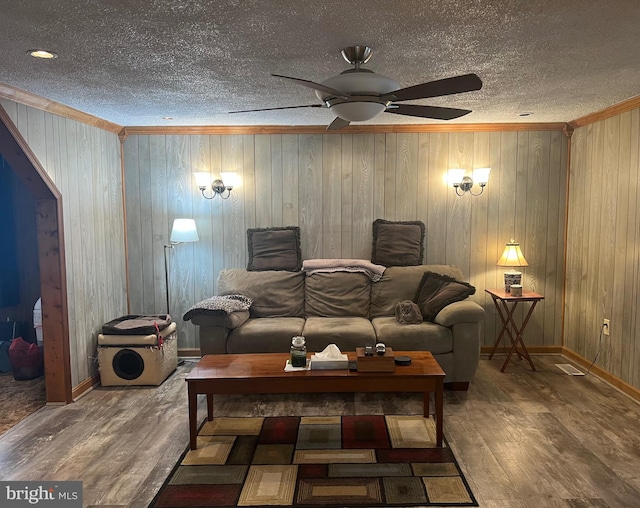 30 Foggy Bottom Ln, Berkeley Springs, WV 25411 - living room featuring hardwood / wood-style flooring, crown molding, ceiling fan, and a textured ceiling
