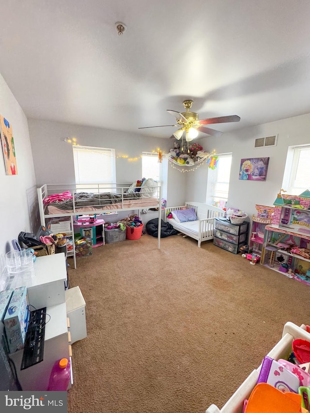 bedroom with ceiling fan and carpet