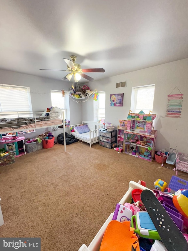 bedroom with ceiling fan and carpet floors