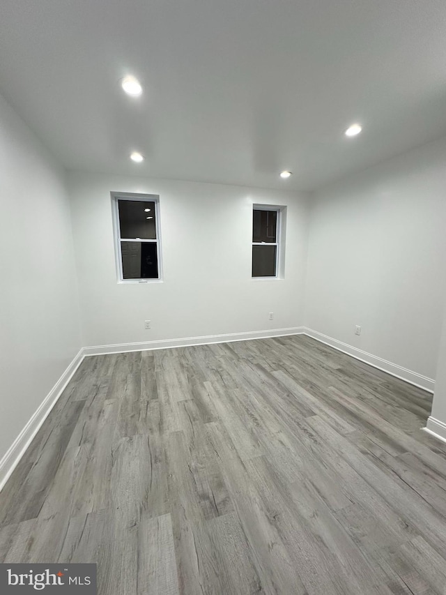 empty room with light hardwood / wood-style floors