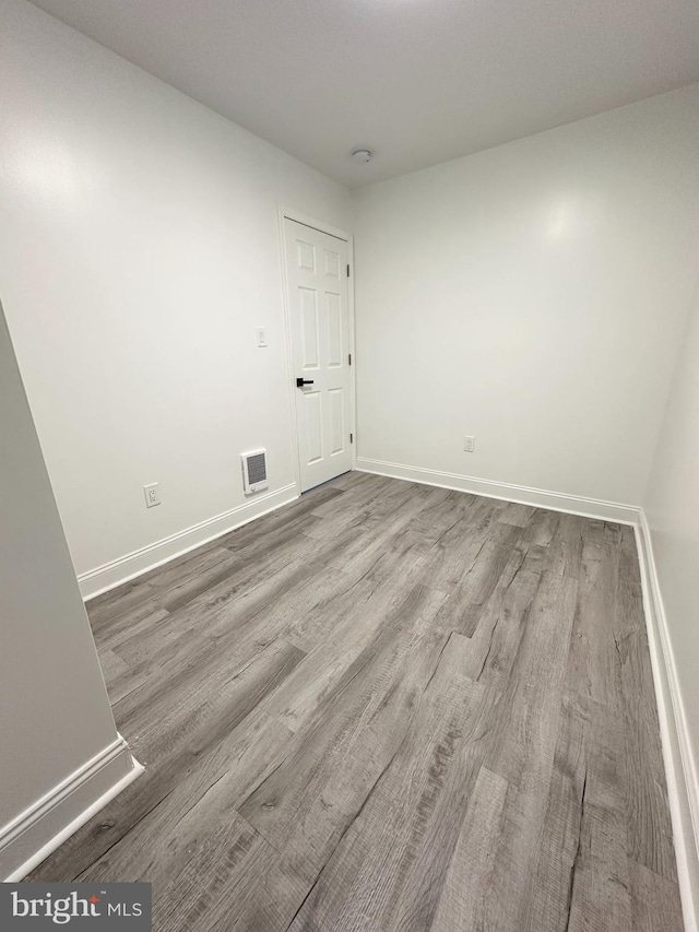 spare room featuring hardwood / wood-style floors