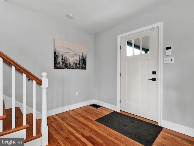 entryway with hardwood / wood-style flooring