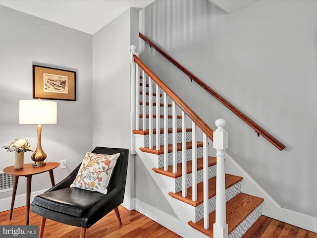 staircase featuring hardwood / wood-style flooring