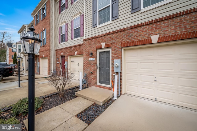 view of exterior entry with a garage