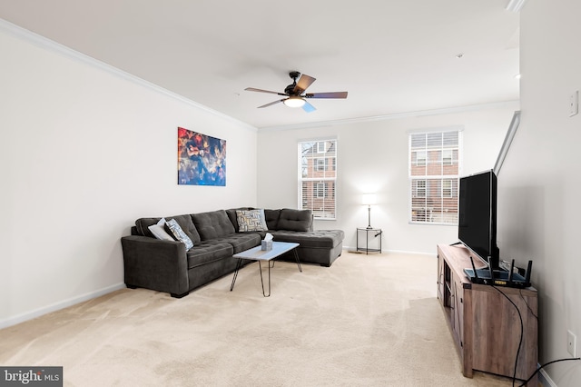 living room with light carpet, ornamental molding, and ceiling fan