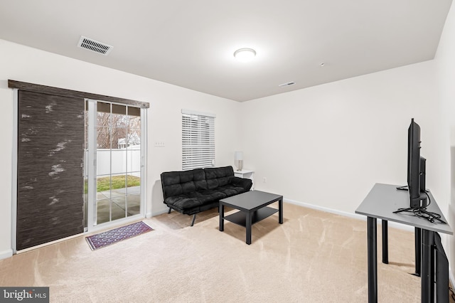 sitting room with light colored carpet