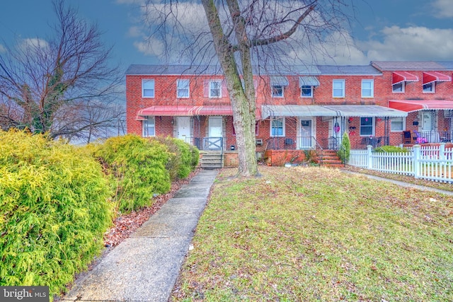 view of property with a front lawn