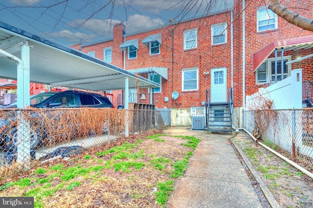 back of property with central air condition unit