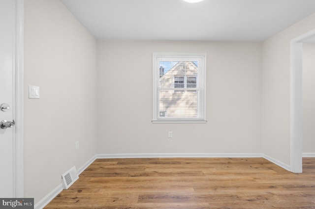 unfurnished room with light hardwood / wood-style flooring