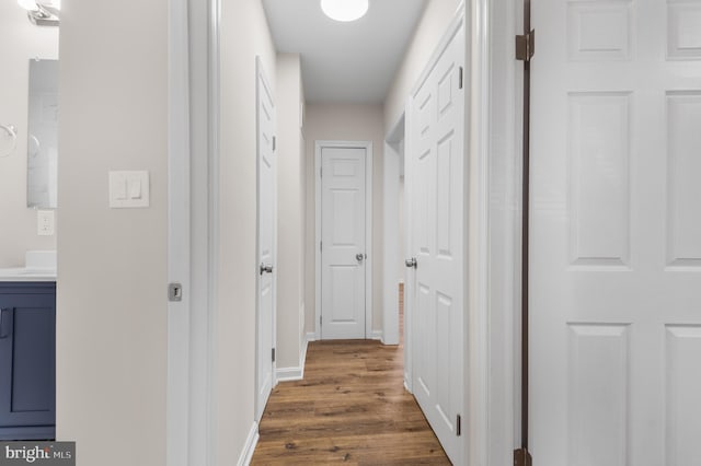 hall with dark hardwood / wood-style flooring