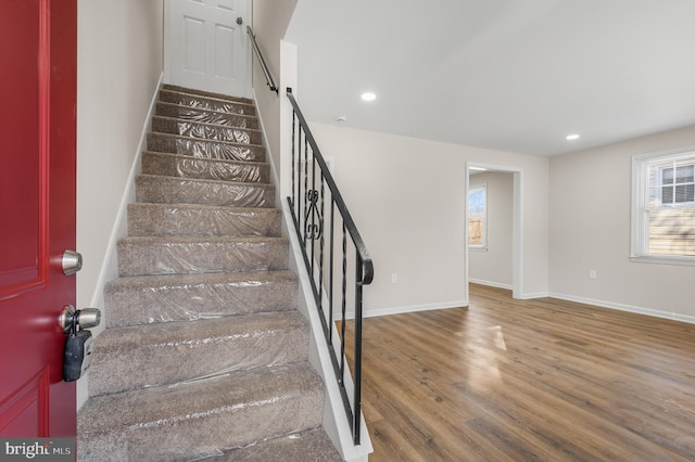 stairway with wood-type flooring