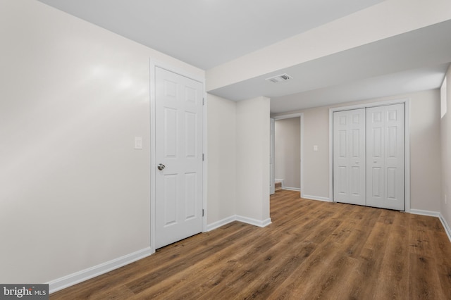 basement with dark wood-type flooring