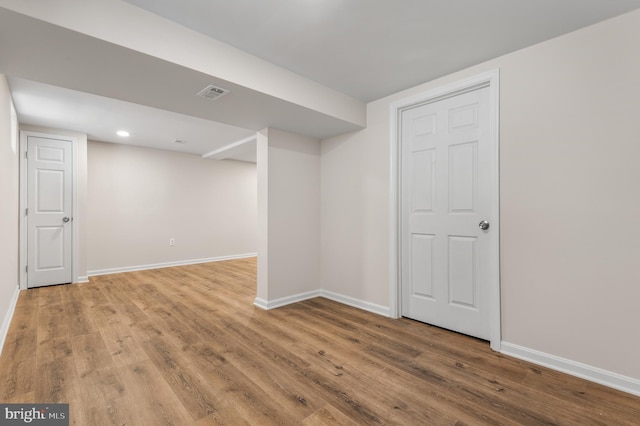 basement featuring light hardwood / wood-style floors