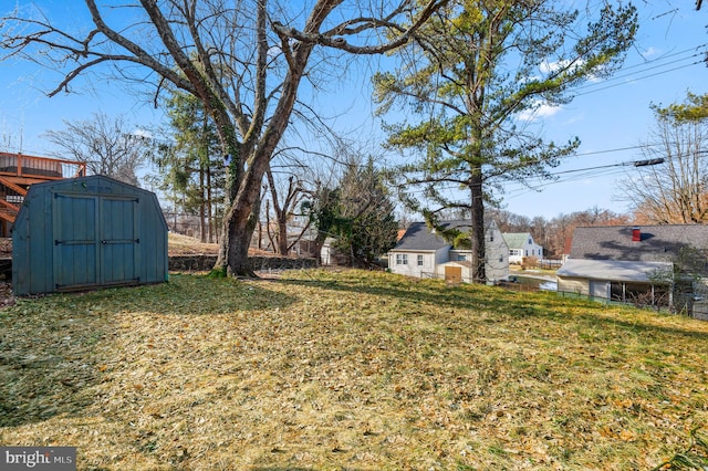 view of yard with a storage unit