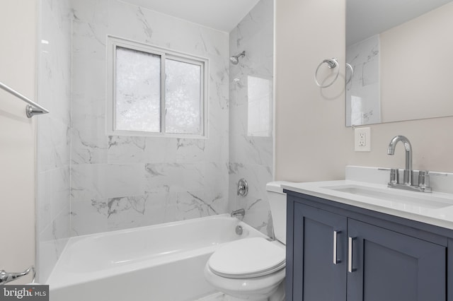 full bathroom with vanity, toilet, and tiled shower / bath combo