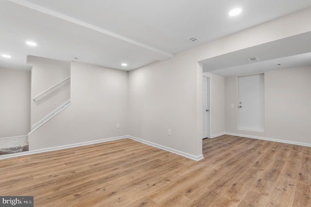 unfurnished room with light hardwood / wood-style floors