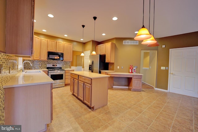 kitchen featuring appliances with stainless steel finishes, hanging light fixtures, a kitchen island, decorative backsplash, and light brown cabinets