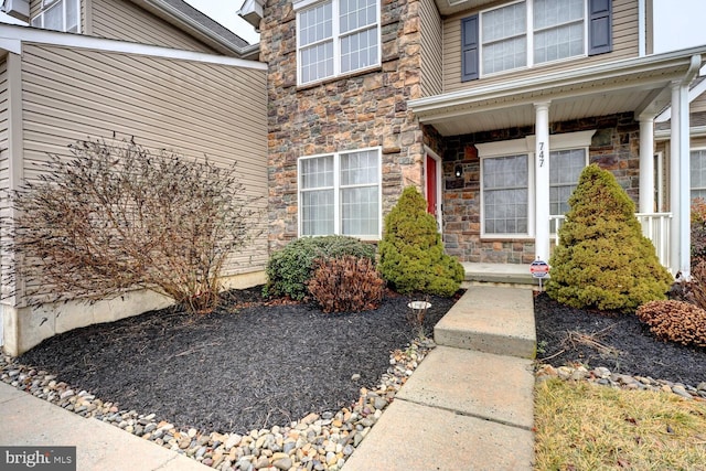 property entrance with covered porch