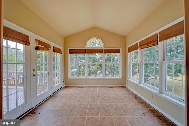 unfurnished sunroom with vaulted ceiling