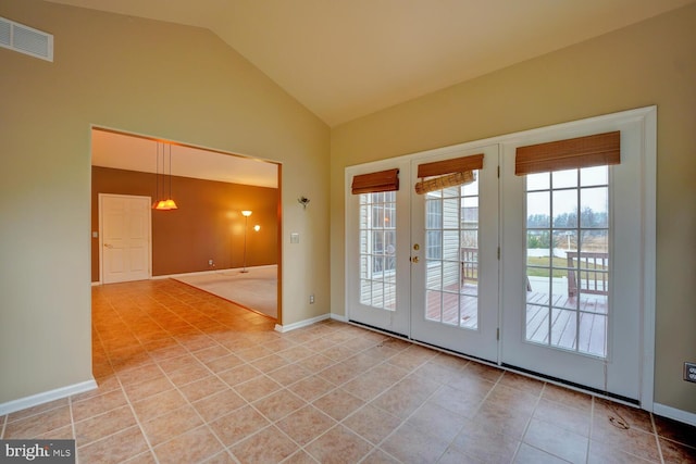 doorway to outside featuring light tile patterned flooring and high vaulted ceiling